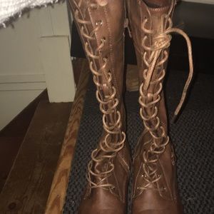 Tall, lace-up combat boots